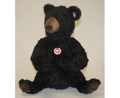 A modern Steiff 'Winnipeg Bear', in black mohair, with button in ear, growler and jointed limbs, limited edition No.486, h.40