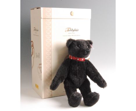 A modern Steiff Teddy Bear, in black mohair with button to ear and white tag no. 038150, limited edition no.01273/3000, boxed