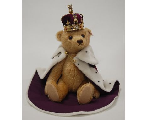 A modern Steiff 'Queen Elizabeth II Coronation' teddy-bear, in blond mohair, with crown and robes, having button to ear, with