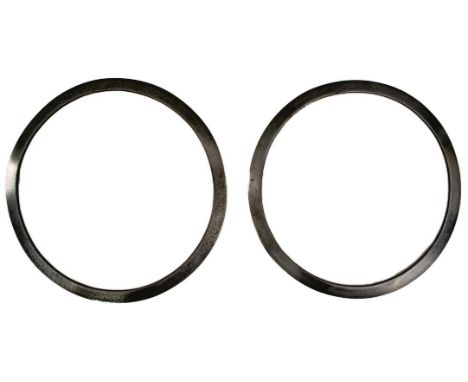 TWO SIKH CHAKRAM, the first 25.75cm diameter and chamfered to the edge with traces of a small panel of engraved geometric des
