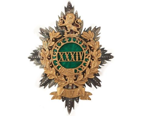 A 34TH (MADRAS NATIVE LIGHT INFANTRY) OFFICER'S SHAKO PLATE, the white metal rayed star applied with a pierced gilt laurel wr