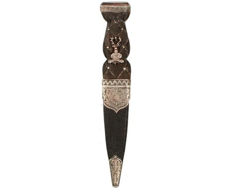 A GORDON HIGHLANDERS OFFICER'S SGIAN DUBH, 9.25cm blade with faceted back edge, tip chipped, characteristic white metal mount