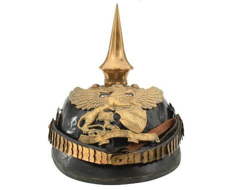 A COMPOSITE BADEN NCO'S PICKELHAUBE, the black leather skull with brass trim and mounts, some lacking, spike finial and Baden