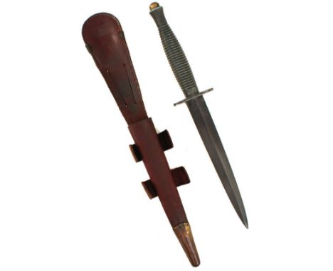 A FAIRBAIRN SYKES THIRD PATTERN B2 COMMANDO KNIFE, 17cm flattened diamond section blued blade, the crossguard stamped with an