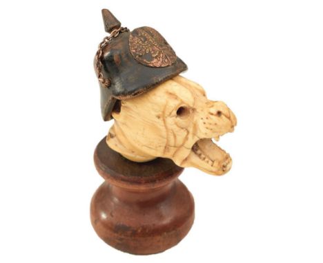 A FIRST WAR PERIOD BULLDOG DESK ORNAMENT, the carved 19th century cane top in the form of a bulldog's head surmounted with a 