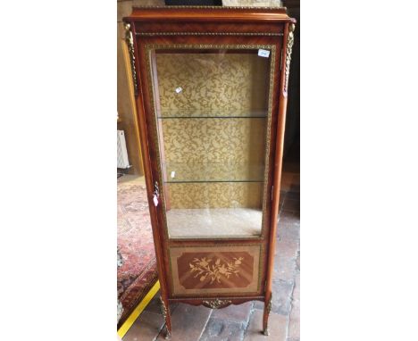 A French style walnut three shelf vitrine with glazed sides, applied moulded brass decoration and marquetry inlaid panel door