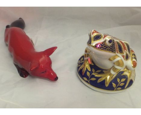 A Royal Crown Derby "Japan" pattern frog figure with gold button to base and a Royal Doulton flambe figure of a crouching fox