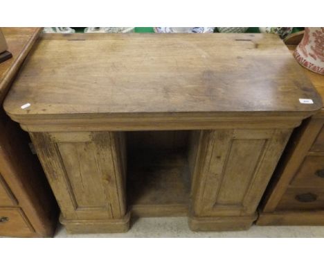 A Victorian pine desk / converted wash stand, the rising top above two cupboard doors raised on a plinth base