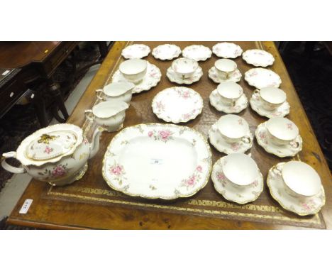 A Royal Crown Derby "Royal Pinxton Roses" pattern tea service comprising teapot, two jugs, sugar bowl, rectangular serving pl