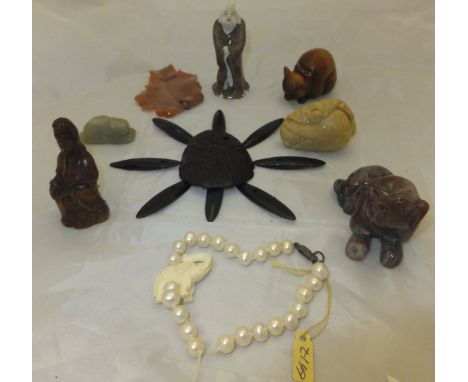 A box containing assorted jewellery to include various carved soapstone and jade beads, various netsukes, etc