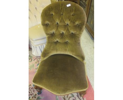 A Victorian spoon back salon chair with button back decoration in green upholstery, raised on cabriole legs, together with a 