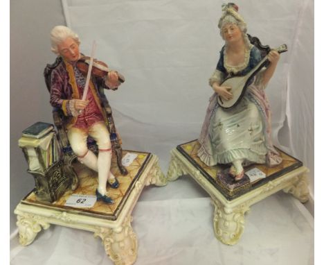 A pair of Royal Dux polychrome decorated pottery figures of musicians, he with a violin, she with a lute CONDITION REPORTS Th