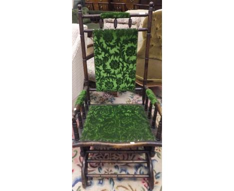 An early 20th Century bobbin turned American style rocking chair