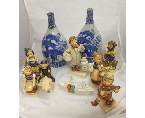 Twenty-two various Goebel Hummel figures, a Royal Adderley chaffinch figure, a Clarice Cliff berry patterned pink ground mug,