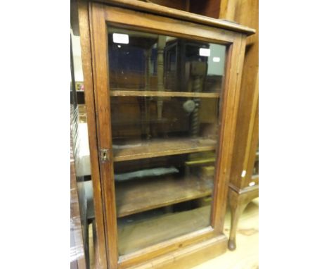 An early 20th Century stained pine glazed bookcase, together with an Edwardian mahogany rectangular occasional table, a wroug