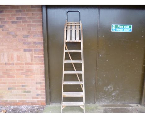 A SET OF WOODEN STEP LADDERS