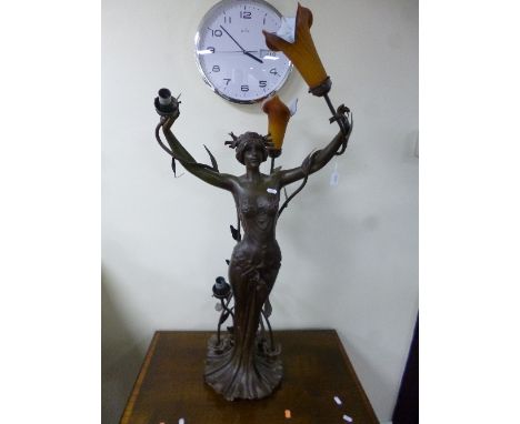 A THREE BRANCH FIGURAL LAMP, modelled as scantily clad Art Nouveau maiden with naturalistic headdress and base, Art d'France 