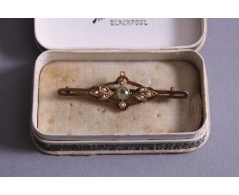 A 15CT GOLD SEED PEARL AND PERIDOT BROOCH
