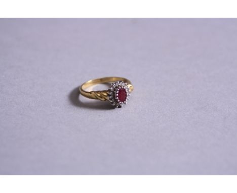 AN 18CT RUBY AND DIAMOND CLUSTER RING, ring size N