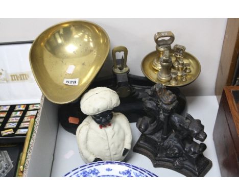 A SET OF BRASS AND IRON SCALES, and seven brass weights 1lb to 1/4oz, a Victorian door stop (s.d.) and a modern money box