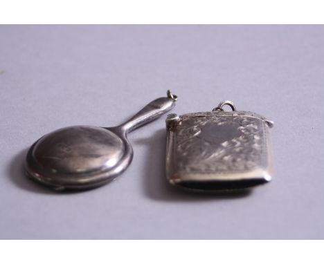 A NOVELTY SILVER MIRROR COMPACT, (Birmingham 1923) and a silver vesta (Birmingham 1903) (2)
