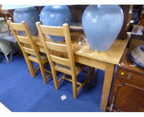 A PINE KITCHEN TABLE, approximate size length 152cm x width 91cm x height 77cm and four oak ladder back chairs (5)