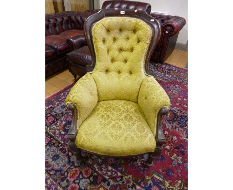 A VICTORIAN MAHOGANY FRAMED BUTTON BACK ARMCHAIR, with gold embossd upholstery (sd)