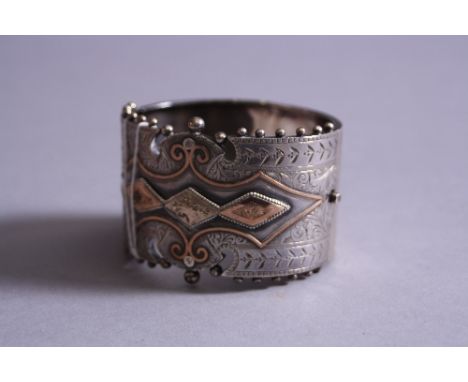 A VICTORIAN SILVER CUFF BANGLE WITH GOLD INLAY