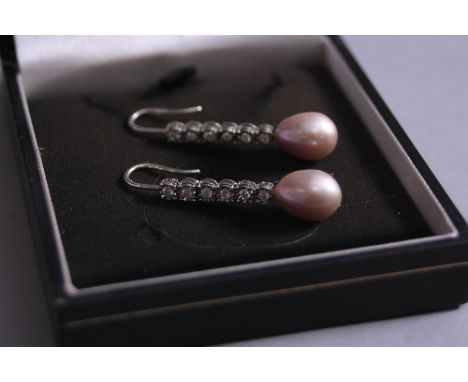 A MODERN PAIR OF CULTURED PEARL AND DIAMOND DROP EARRINGS, measuring 41mm in length, fitted to fixed position hook wires, two