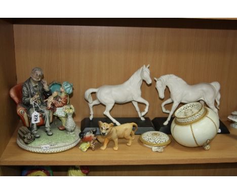 A CAPODIMONTE FIGURE GROUP, of a doctor and a girl, modelled by Tiziano Galli, together with two white glazed Beswick horses 