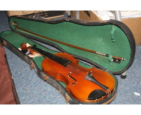 A 20TH CENTURY VIOLIN, two piece back, bears paper label facsimile Stradivarius, together with a bow