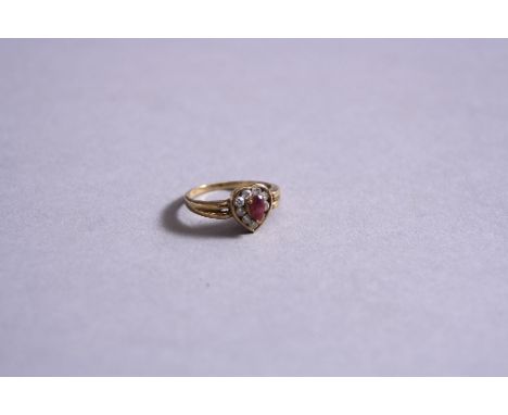 A MODERN RUBY AND DIAMOND HEART SHAPE CLUSTER RING, total diamond weight approximately 0.36ct, colour assessed as I-J, clarit