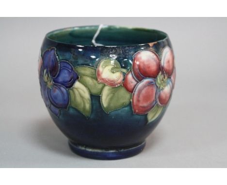 A MOORCROFT POTTERY PLANTER, Clematis pattern on a blue/green ground, impressed marks, height approximately 11cm