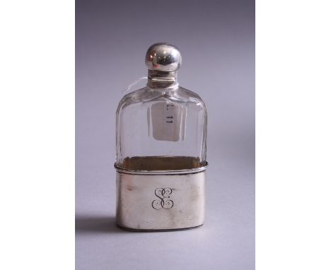 A SILVER BASED AND TOPPED GLASS FLASK