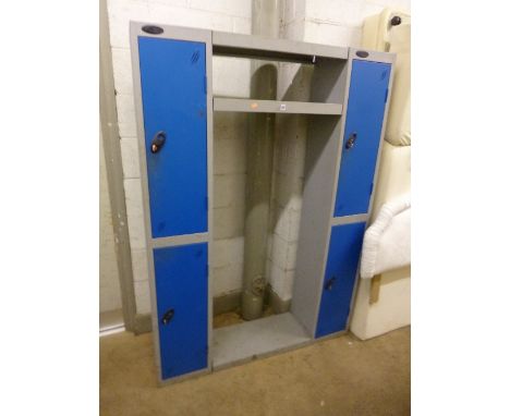 A METAL LOCKER, with four doors and central shelf (no extra shelves) (four keys)