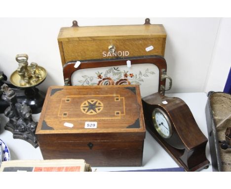 A MAHOGANY AND INLAID SEWING BOX, an Edwardian mahogany and satinwood banded mantel clock, a tray and a wooden first aid box 