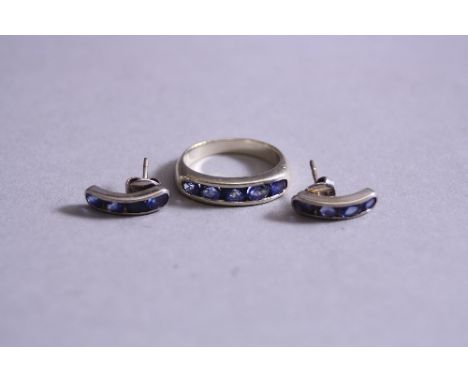 AN 18CT WHITE GOLD TANZANITE RING, with matching ear studs, ring size O