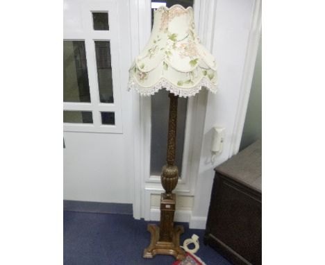 A CARVED OAK STANDARD LAMP, and shade
