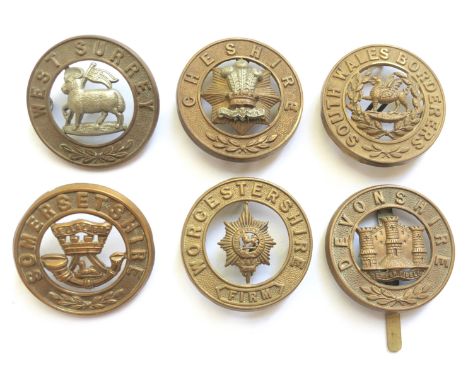 5 post 1881 helmet plate centres &amp; Devonshire pagri badge.Queen’s ... Cheshire  ... South Wales Borderers ... Somerset ..