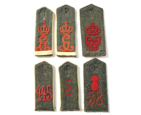 WW1 Imperial German Field Grey Shoulder Straps.A selection of of six field grey shoulder straps with red embroidered crowned 