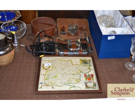 An oak framed map of Essex; a Kodak boxed camera; an oriental leather stirrup; gent's collar box; and an Army issue men's lea