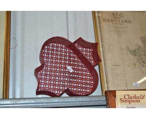 A Moroccan red painted wall shelf