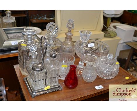 A plated four bottle cruet, three decanters, fruit bowl, candlestick, powder jar etc.