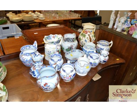 A collection of various Victorian and later jugs; to include Masons, Spode etc.