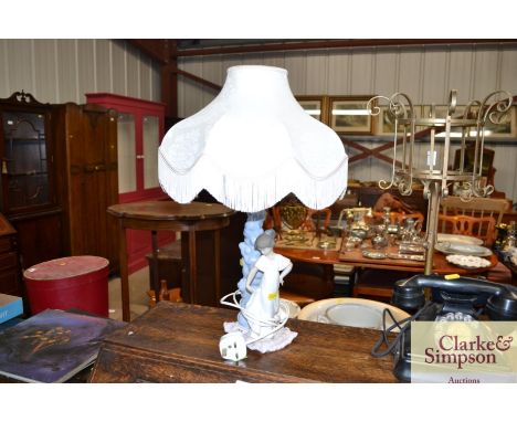 A Nao figural decorated table lamp and shade