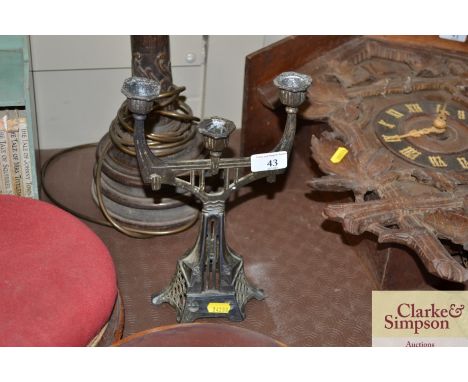 An Art Deco design metal three light candelabra 