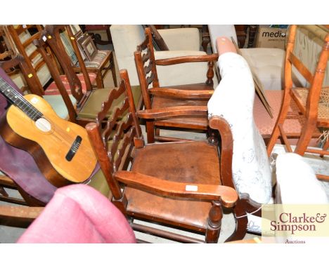 A pair of elm ladder back elbow chairs