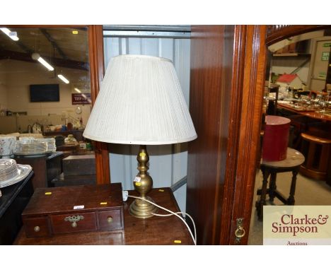 A brass table lamp and shade 