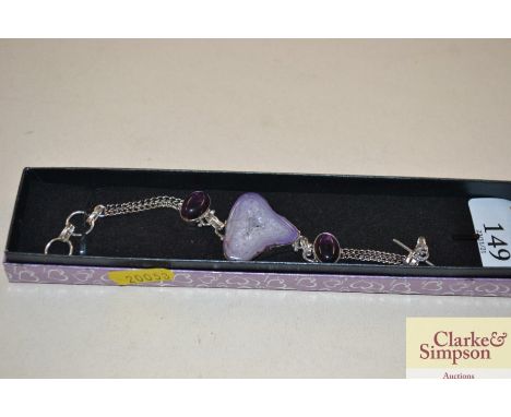A 925 bracelet set amethyst coloured stones 