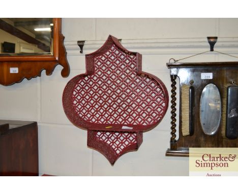 A red Moroccan wall shelf 